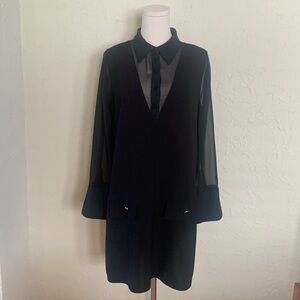 Zara, black mini dress with sheer accents.